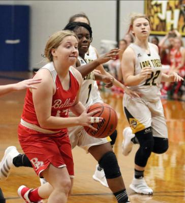 Bellville senior Sarah Hart drives the lane in a non-district game against Sealy on Dec. 5, 2019. The Brahmanettes and Lady Tigers meet this Friday in what will be a district game after the recent realignment of the University Interscholastic League. File photo