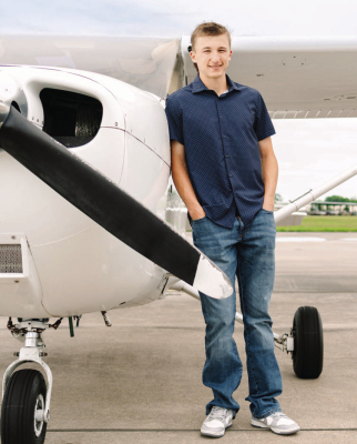 Sealy graduate and future Air Force Academy cadet Jackson Blanks stands next to a plane.