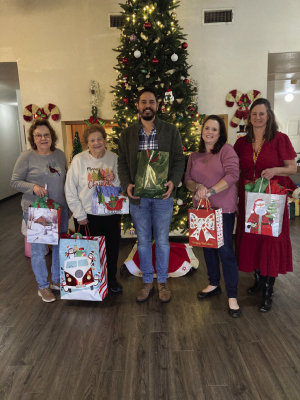 The Catholic Daughters at St. Mary's in Frydek, Court Our Lady of Faith #2607, donated and delivered almost hundred gifts for the residents of the two Sealy retirement homes Silver Lakes and The Oaks. They hope to bring joy and glad tidings to all these wonderful people during the holiday season. From left are Recording Secretary Cathy Ondruch, Regent Doris Sodolak, Andrew Tirey manager of the retirement homes, Religious Education Director Sarah Blundell and Church Secretary Theresa Young.