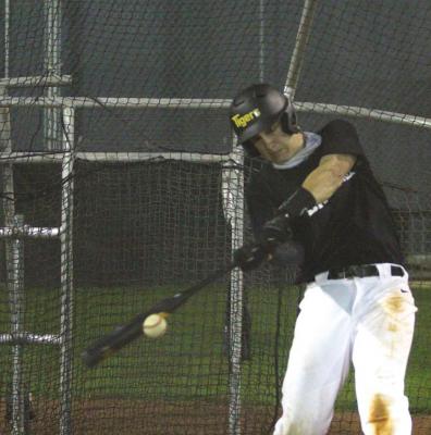 Sealy junior Bass Blundell connects with a pitch during the Tigers’ first official day of workouts Jan. 22 at Aubrey “Mutt” Stuessel Stadium. COLE McNANNA