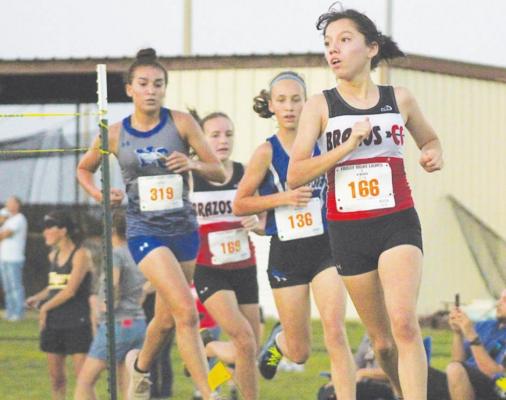 Brazos junior Esmeralda Garcia makes a turn during the Frio Friday Night Lights meet at Sealy High School Aug. 20. Garcia recently added all-state and all-star honors from the Texas Girls Coaches Association. COLE McNANNA
