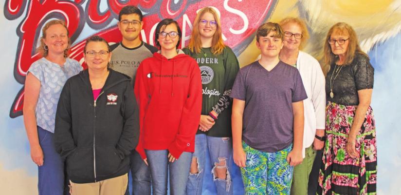 Students and staff pose for a photograph while attending the 28th Annual Debate Day Camp at Brazos High School. They include Rachel Divin (left), Fabian Castillo, Alex Taylor, Tina Patton, Linda Alderson, Nikki Nolen, Quinn Babb and Carter Alderson. JASON MANAGO-GRAVES
