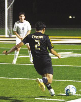 #2 Maximino Requena curls in a free kick effort towards the box in hopes of connecting with a Tiger’s head. PHOTO BY ABENEZER YONAS