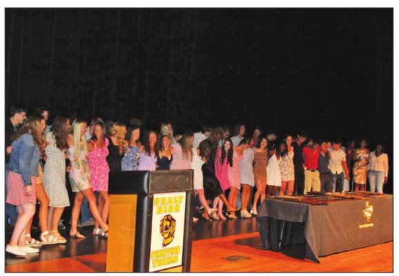 The Sealy High School seniors are pictured singing their alma mater during the awards ceremony. JASON MANAGO-GRAVES