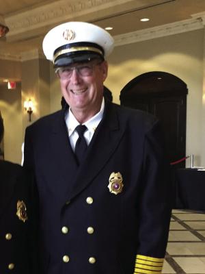 Cat Spring VFD Fire Chief Randy Reichardt is honored by the Houston 100 Club during a recent ceremony. Reichardt announced he is retiring from the department after 47 years of service. COURTESY PHOTO