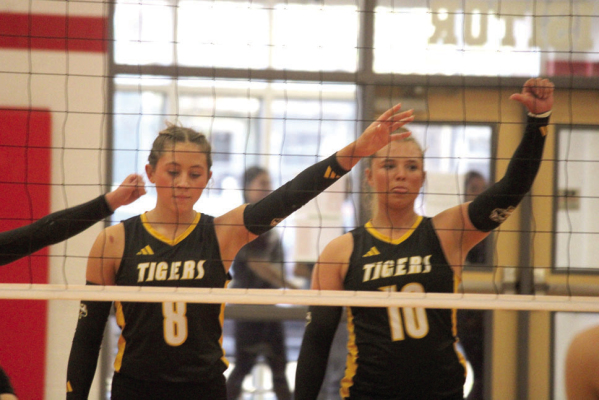 Ryanne Meyer (left) and Jade Barton guard the net for the Lady Tigers during a game against the Columbus Lady Cardinals in Columbus on Oct. 27 SEALY NEWS | EVAN HALE
