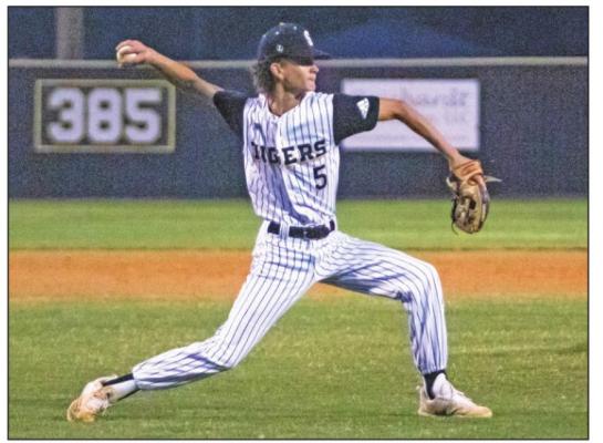 Sealy junior Ethan Doyle fields his position and prepares a throw to first for a fifth-inning out during the Tigers’ district tilt with El Campo Monday at Aubrey “Mutt” Stuessel Stadium. COLE McNANNA