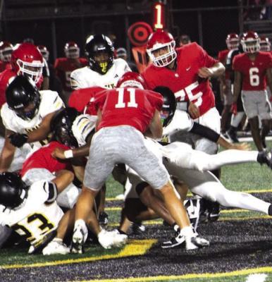 The scrimmage was very physical in the trenches. On the bottom of the pile wrapping up the Columbus ballcarrier is linebacker Jardon Hernandez, 23, and flying into the pile is linebacker Isaiah Dukes-Self.