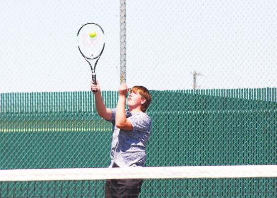 Connor Vesely lines up a shot during a quad-match hosted by Sealy on March 3. Vesely competed with Trinity Harding in the mixed doubles competition at the District 24-4A Championships in Bellville last week. COLE McNANNA