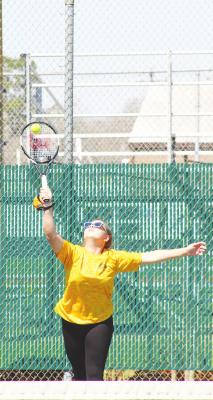 Trinity Harding connects on a hit during a quad-match hosted by Sealy on March 3. Harding competed with Connor Vesely in the mixed doubles competition last week in Bellville at the District 24-4A Championship. COLE McNANNA