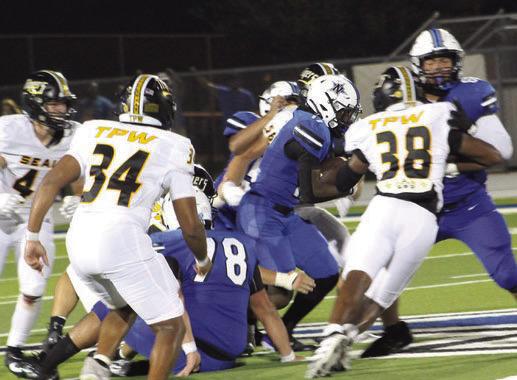 Sealy’s swarming defense held Navasota’s running game to 99 yards. It was their passing attack where the Rattler offense had success. Tigers pictured in L-R order are: Beau Finley, 4, Isaiah Dukes-Self, 34, Clay Bartek, 56, and Javion Johnson, 38. Sealy defeated Navasota 33-18 in the season opener for both teams.