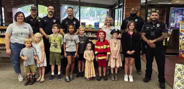 Every summer the library holds reading contests for various age groups to encourage reading. Front row left to right: Harvey McArthur, Nora McArthur, Ryan Brandau, Grace Washington, Cayden Chapman, Caroline Pickering, August Pickering, Bethany Pickering and Arya Moyers. Back Row Left to Right: Bridget Cano, Sealy PD and AbbyLynn Moyle. COURTESY PHOTO