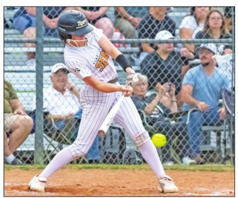 Sealy freshman Amorin Hofford connects on a pitch in the first inning of the Lady Tigers’ District 24 battle against El Campo at home Monday, April 11. COLE McNANNA