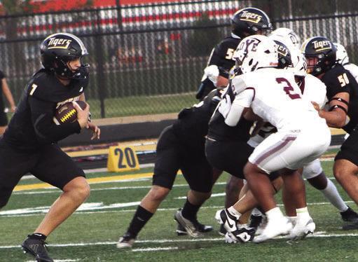 Sealy offensive linemen create a wall for quarterback Kane Killough, with football, to turn the corner for Sealy’s second touchdown against Cameron. Killough scored three touchdowns in Sealy’s 64-0 win.
