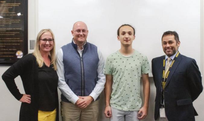 Board Vice President Katy Grigar, Superintendent Bryan Hallmark, Sealy junior Wyatt Martinez and Band Director Oscar Cano recognized Martinez’ achievement of first-chair trumpet in the all-state band during the regular meeting of the Sealy ISD Board of Trustees last Wednesday. PHOTOS BY COLE McNANNA