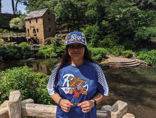 Abigail Hernandez holds up “Lil Johnny,” the logo for Johnny B Good Lock &amp; Safe, in front of the Old Mill in Arkansas. Abigail was on her way to Williamsport, PA for the Maria Pepe Legacy Series. COURTESY | JOSEPH HERNANDEZ