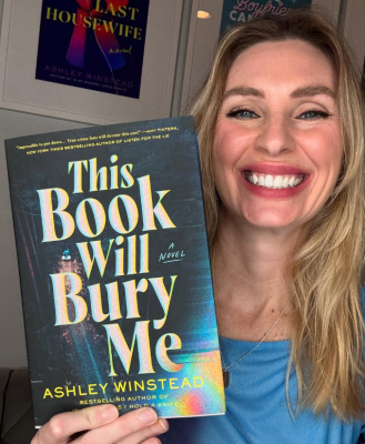 Bestselling author Ashley Winstead holds up a copy of her most recent novel “This Book Will Bury Me.” COURTESY OF KRIS GRAHAM, THE STORY PEDDLER