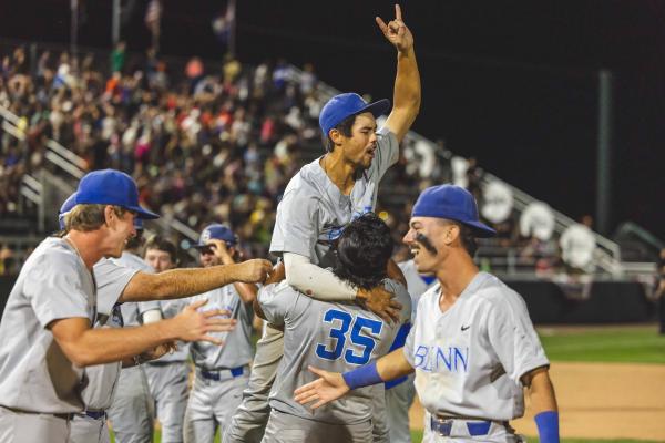 Blinn’s Connor McGinnis celebrates with Bryson Dudley after Blinn clinched the JUCO baseball championship. COURTESY PHOTO