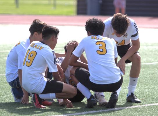 The Tigers console their captain #2 senior Maximino Requena after losing the game, where he put in a decisive own goal in the final 5 seconds.