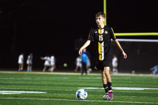 Junior midfielder Pedro Alvarez looks to ping a ball out to one of his forwards. PHOTOS BY ABENEZER YONAS