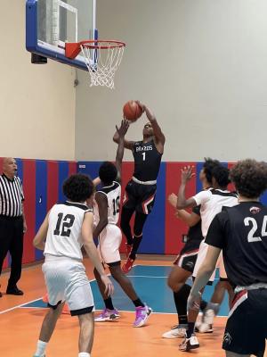 Jarvse Dickerson (1) scoring on an inside bucket for the Cougars. Courtesy photo 