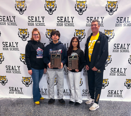 Pictured above are Sealy Head Cross Country Coach Danielle Eschenburg, Aaron Munoz, Samantha Huerta, and Assistant Cross Country Coach Val Eschenburg.