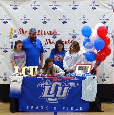 Seated: Elizabeth Kaitlyn Walker (signing with LCU), left to right back: Emmaline Walker (sister), Nick Walker (father), Kensington Walker, (sister), Alison Walker (mother).