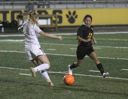 Lady Tiger senior Valerie Villagomez attacks a Giddings defender during Sealy’s non-district contest at T.J. Mills Stadium on Jan. 5. (Cole McNanna/Sealy News)