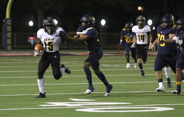 Tiger senior Draper Parker delivers a stiff arm on a punt return during Sealy’s regular-season finale against La Marque at Stingaree Stadium in Texas City, Nov. 6, 2020. COLE MCNANNA