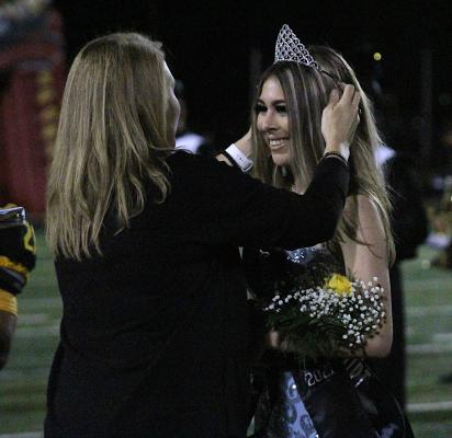 Mercedes Lozano is crowned Homecoming Queen by Sealy High School Principal Megan Oliver during the halftime ceremony last Friday on Mark A. Chapman Field at T.J. Mills ls Stadium. COLE McNANNA