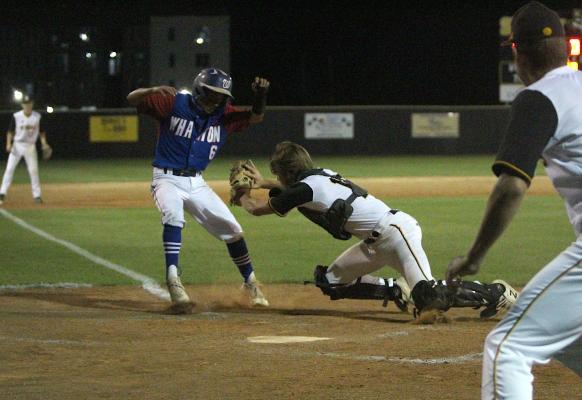 Sealy senior catcher Blake Zaskoda goes to apply the tag on a Wharton runner attempting to score in the fifth inning of a district game at Aubrey “Mutt” Stuessel Stadium April 24. (Cole McNanna/Sealy News)