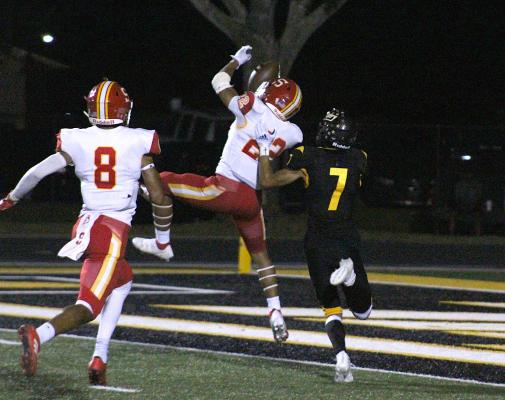 Stafford sophomore defensive back Briytan Buckner secures one of four interceptions the Spartan defense came down with during Friday's non-district game against Sealy at T.J. Mills Stadium. COLE McNANNA