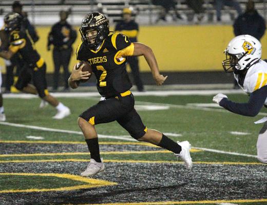 Sealy junior quarterback D’vonne Hmielewski hits the open field en route to his 55-yard touchdown in the first quarter of the Tigers’ regular-season finale against La Marque on Mark A. Chapman Field at T.J. Mills Stadium Friday night. COLE McNANNA