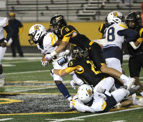 Tiger juniors Mason Klotz (18) and Richard Hahn (25) corral a La Marque ball carrier during Sealy’s district finale Nov. 5 at T.J. Mills Stadium. Klotz represented the Tigers on the first-team all-district and Hahn was a second-team all-district honoree.