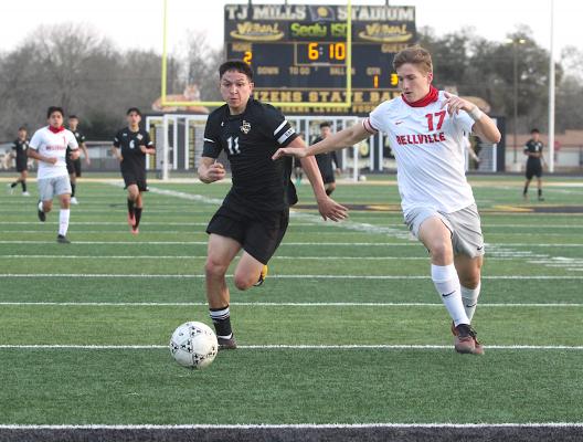 Tiger senior Ricky Avila battles for a ball in the corner during Sealy’s home district finale against Bellville March 8 at T.J. Mills Stadium. (Cole McNanna/Sealy News)