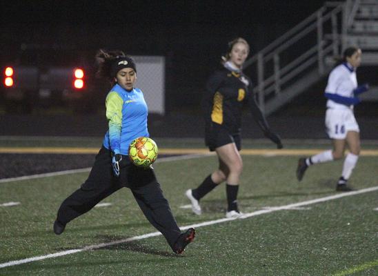Lady Tiger junior goalkeeper Hailey Arteaga loads up to send a ball down the field after making a save against Needville in a non-district battle last Monday evening at T.J. Mills Stadium.