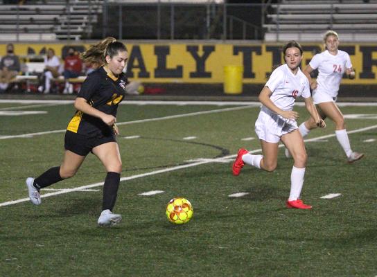 Sealy junior Destinee Castillo advances a ball during the Lady Tigers’ home district finale against Bellville March 8 at T.J. Mills Stadium. (Cole McNanna/Sealy News)