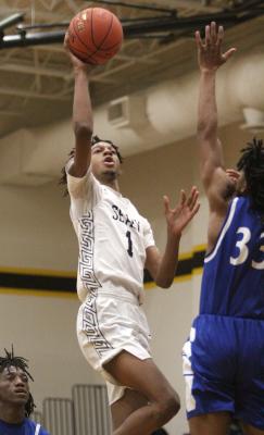 Sealy senior Donte Beasley puts up a fadeaway shot in the paint during the Tigers’ district game against Navasota on Jan. 15. (Cole McNanna/Sealy News)