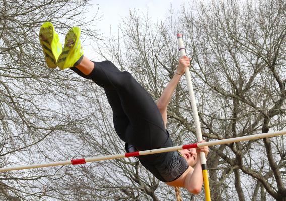 Lady Tiger junior Breanna Brandes clears a pole vault attempt at the annual Sammy Dierschke Relays at T.J. Mills Stadium in Sealy March 11. Brandes went on to set the school record at 11’ 7”. COLE McNANNA