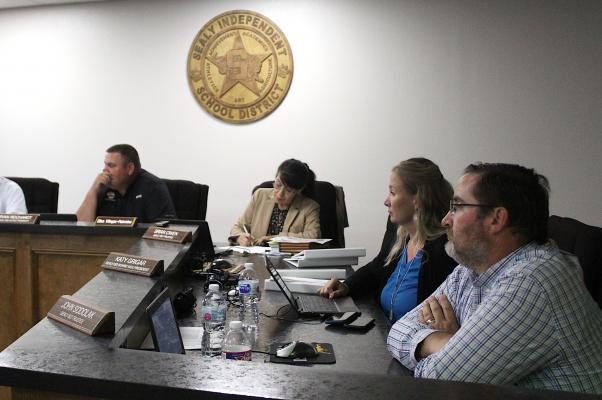 Sealy ISD Trustee John Sodolak, right, sat on his first regular meeting in the board room of the Administration Building after being elected in May. His prior meetings were held at the junior high and high school cafeterias. COLE McNANNA