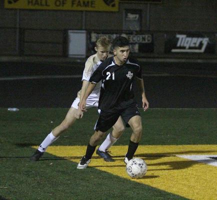 Sealy sophomore Amador Lopez wins a battle in the corner and looks to make a pass during the Tigers’ non-district win over Giddings on Jan. 18 at T.J. Mills Stadium. (Cole McNanna/Sealy News)