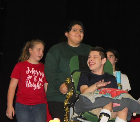 Chris circles around the stage during the Chance to Dance Holiday Recital grand finale performance to the song Feliz Navidad Nov. 16 in the Sealy Junior High Auditorium. PHOTOS BY COLE McNANNA