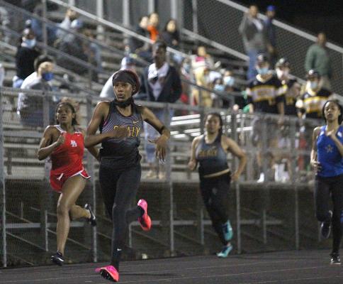 Sealy freshman Taniah Coleman sprints the 100-meter dash during March 11’s Sammy Dierschke Relays at T.J. Mills Stadium. Coleman continued her successful season with a district championship in the event last week. (Cole McNanna/Sealy News)