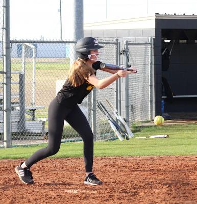 Sealy freshman Emersyn Cryan lays down a bunt at the Lady Tigers’ Friday afternoon practice at Sealy High School. (Cole McNanna/Sealy News)