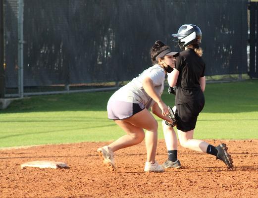 Sealy senior Kayla Camacho applies the tag on a baserunner during the Lady Tigers’ practice last Friday afternoon at Sealy High School. The softball season is set to begin on Feb. 16. (Cole McNanna/Sealy News)
