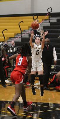 Sealy senior Brylie Bond lifts a three-pointer as part of a team second-best eight points in the Lady Tigers’ loss to Royal last Friday at home. (Cole McNanna/Sealy News)
