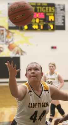 Lady Tiger junior Julia Jurecka reached for a rebound during Sealy’s District 24-4A game against Royal last Friday at home. (Cole McNanna/Sealy News)