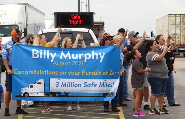 Family, friends and coworkers greeted Billy Murphy at the truck gate of the Sealy Walmart Distribution Center Wednesday afternoon in celebration of Murphy’s milestone. COLE McNANNA
