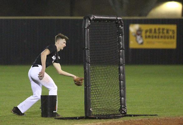 Tiger senior Tyler Hennessey makes a catch on a pop up just behind the screen he was standing behind to retrieve all of the hit baseballs during batting practice at the first official day of practice last Friday. (Cole McNanna/Sealy News)