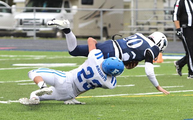 Faith Academy senior Preston Browning records a tackle of Northside sophomore Kaven Geoffrion during the TAIAO State Championship game at Allen Academy Nov. 27.